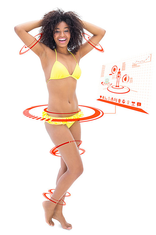 유토이미지 composite image of fit woman in yellow bikini smiling at camera