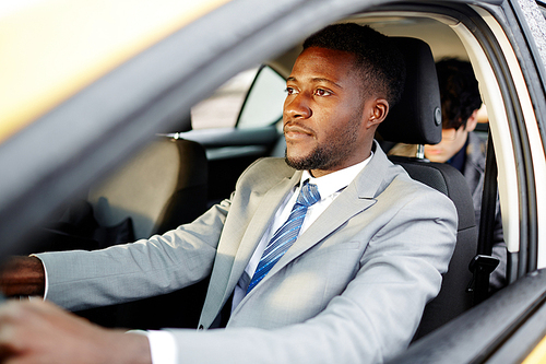 Portrait Of Successful African American Businessman Driving