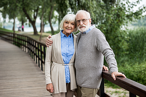 Selective Focus Of Happy Senior Couple Hugging While Standing