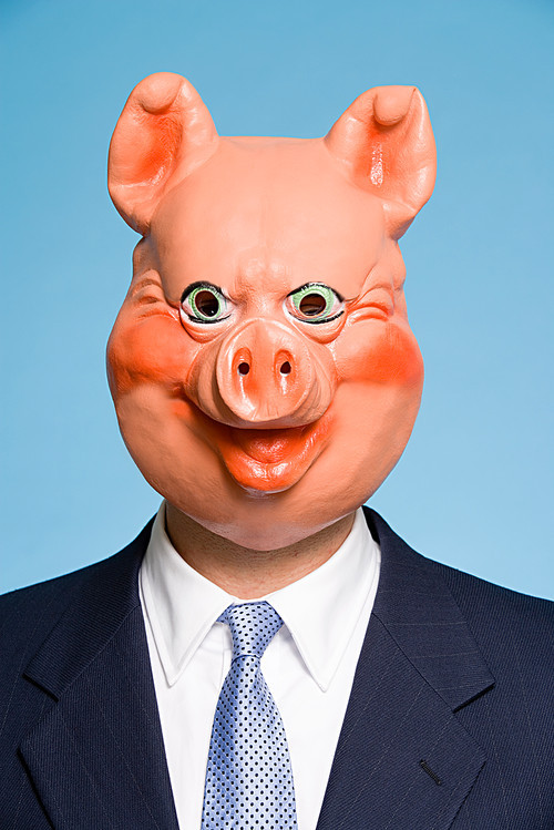 Businessman wearing a pig mask