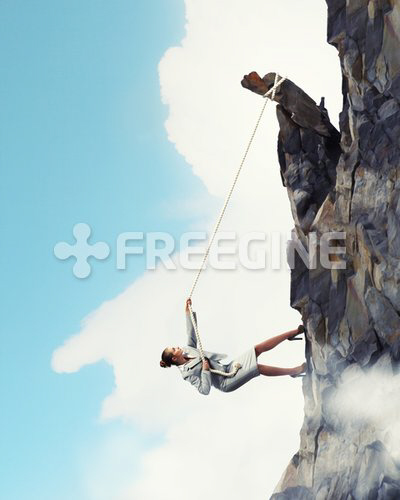 businesswoman climbing mountain