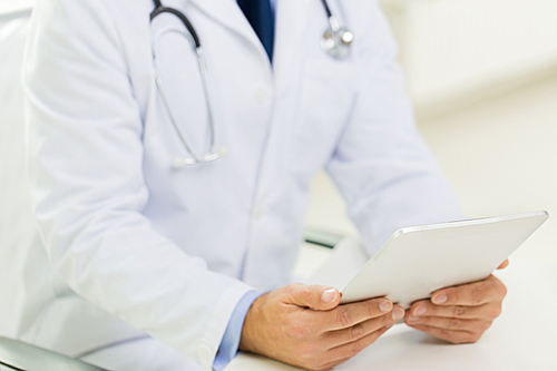 medicine, health care, people and technology concept - close up of f male doctor hands with tablet pc computer