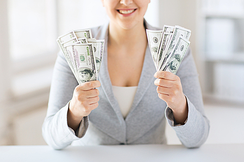 business, finance, saving, banking and people concept - close up of woman hands holding us dollar money