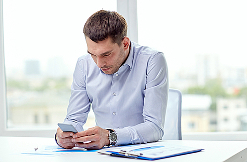 business, deadline, people and technology concept - close up of businessman with smartphone