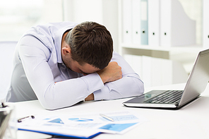 business, people, fail, paperwork and technology concept - businessman with laptop computer and papers working in office