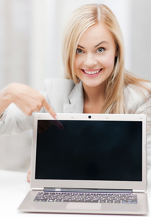 picture of smiling businesswoman with laptop computer