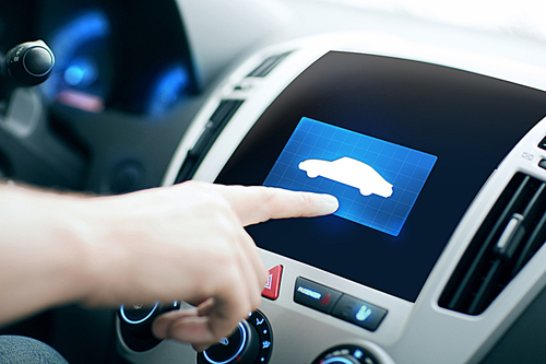 transport, modern technology and people concept - male hand pointing finger to car icon on control panel screen