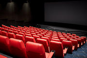 entertainment and leisure concept - movie theater or cinema empty auditorium with red seats