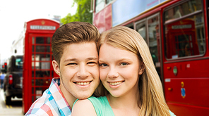 travel, vacation, technology and friendship concept - happy couple over london city street background