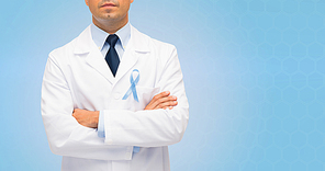 healthcare, profession, people and medicine concept - close up of male doctor in white coat with sky blue prostate cancer awareness ribbon