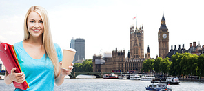 education, school, study abroad, drinks and people concept - smiling student girl with folders and cup of coffee over london city background