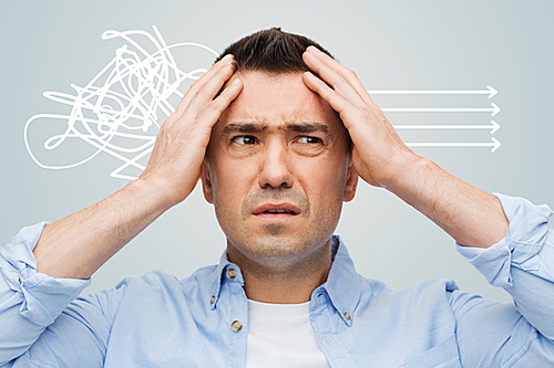 stress, headache, health care and people concept - unhappy man with closed eyes touching his forehead