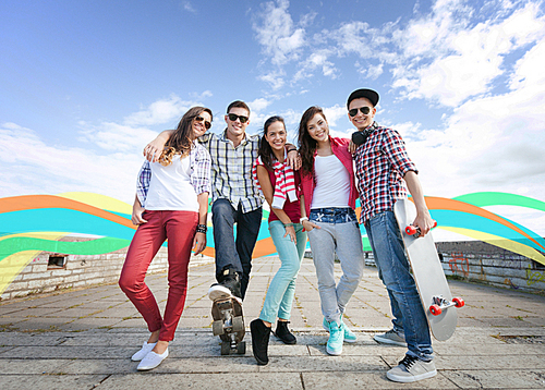 summer holidays and teenage concept - group of teenagers with skates outside