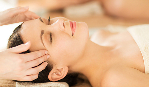 close up of woman in spa salon getting face treatment