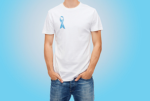 medicine, health care and people concept - man in t-shirt with blue prostate cancer awareness ribbon