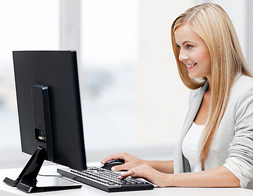 picture of smiling businesswoman using her computer