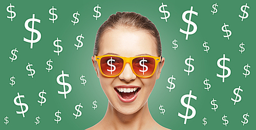 people, finance and money concept - happy screaming teenage girl in shades over green background with dollar currency sings