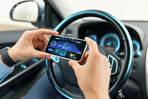 transport, business trip, technology and people concept - close up of male hands with navigation system on smartphone screen in car