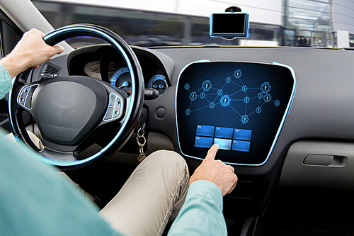 transport, road trip, technology, communication and people concept - close up of man driving car with network icons on board computer