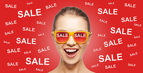 people, summer, shopping and sale concept - happy screaming teenage girl in shades over red background with sale signs