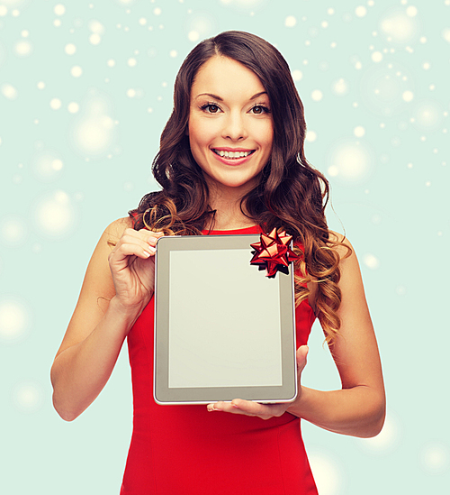 christmas, x-mas, electronics, gadget concept - smiling woman with blank screen tablet pc