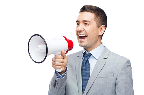 business, people and public announcement concept - happy businessman in suit speaking to megaphone