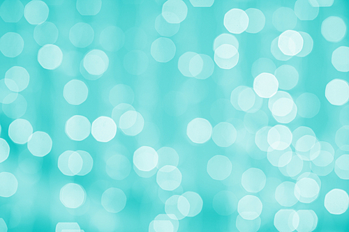 holidays, party and celebration concept - blurred green blue background with bokeh lights