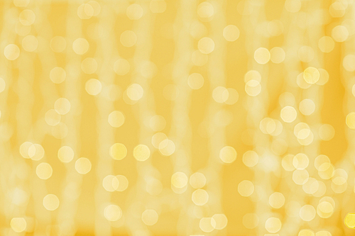 holidays, party and celebration concept - blurred golden background with bokeh lights