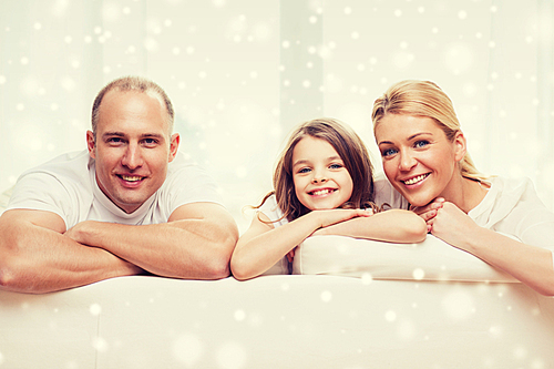 family, childhood, people and home concept - smiling parents with little girl at home