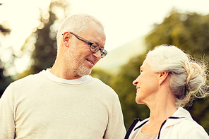 family, age, tourism, travel and people concept - senior couple in city park