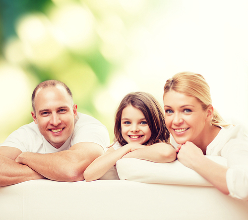 family, childhood, ecology and people - smiling mother, father and little girl over green background