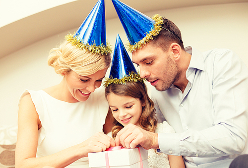 celebration, family, holidays and birthday concept - happy family with gift box