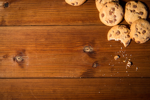 baking, cooking , holidays and food concept - close up of oat cookies on wooden table