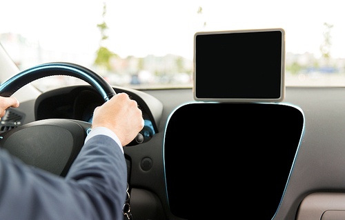 transport, business trip, technology, navigation and people concept - close up of businessman with black blank tablet pc and on board computer driving car