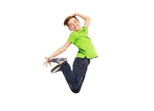 happiness, childhood, freedom, movement and people concept - smiling boy jumping in air