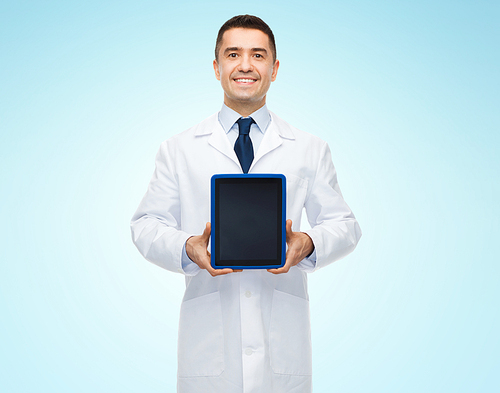 medicine, profession, advertisement and healthcare concept - smiling male doctor showing tablet pc computer blank screen