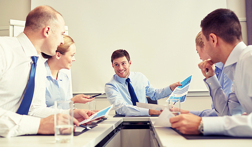 business, people and teamwork concept - group of smiling businesspeople meeting in office