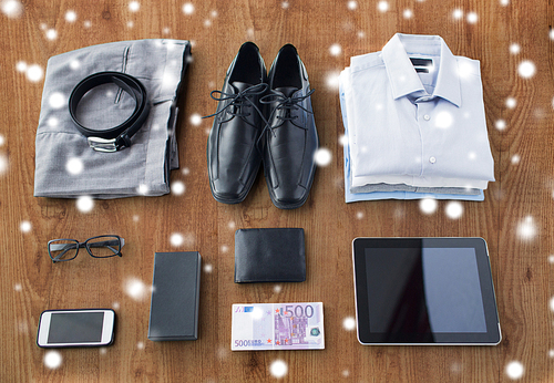 business, style, clothes and objects concept - close up of formal male clothes and personal stuff on wooden table at home over snow effect