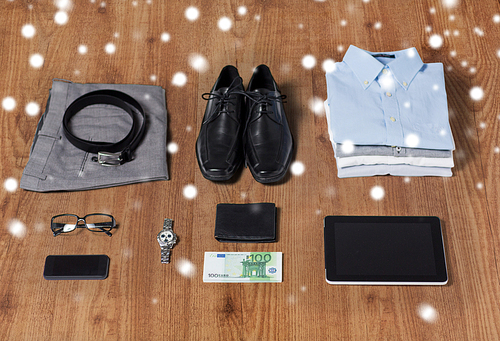 business, style, clothes and objects concept - close up of formal male clothes and personal stuff on wooden table at home over snow effect