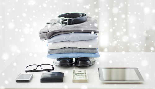 business, style, clothes and objects concept - close up of formal male clothes and personal stuff on table at home over snow effect