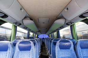 transport, tourism, road trip and equipment concept - travel bus interior