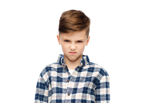 childhood, emotion, anger, hate and people concept - angry boy in checkered shirt