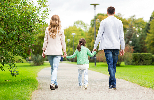 family, parenthood, adoption and people concept - happy mother, father and little girl walking in summer park