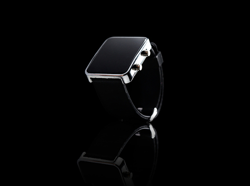 modern technology, time, object and media concept - close up of black smart watch