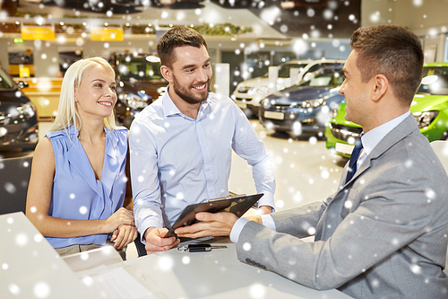 auto business, sale and people concept - happy couple with and dealer with clipboard buying car in auto show or salon over snow effect