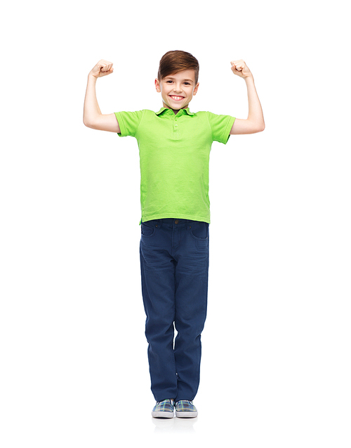 childhood, power, strength and people concept - happy smiling boy in green polo t-shirt showing strong fists