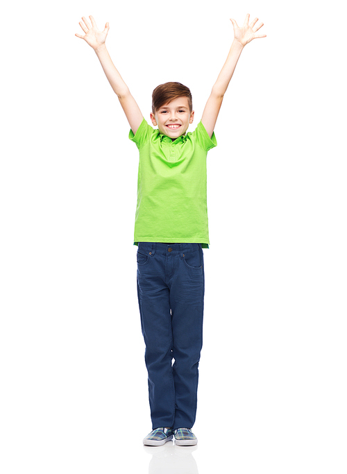childhood, fashion, power, joy and people concept - happy smiling boy in green polo t-shirt raising hands up