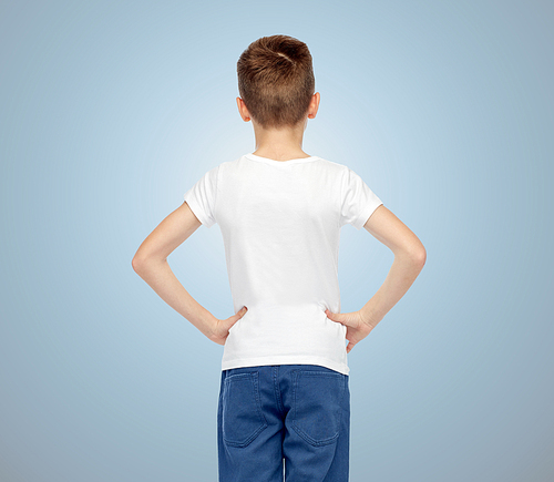childhood, fashion, advertisement and people concept - boy in white t-shirt and jeans over blue background from back