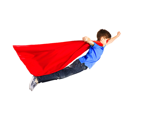 happiness, freedom, childhood, movement and people concept - boy in red superhero cape and mask flying in air