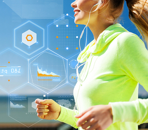 technology, sport, fitness, exercise and lifestyle concept - smiling woman doing running with earphones outdoors